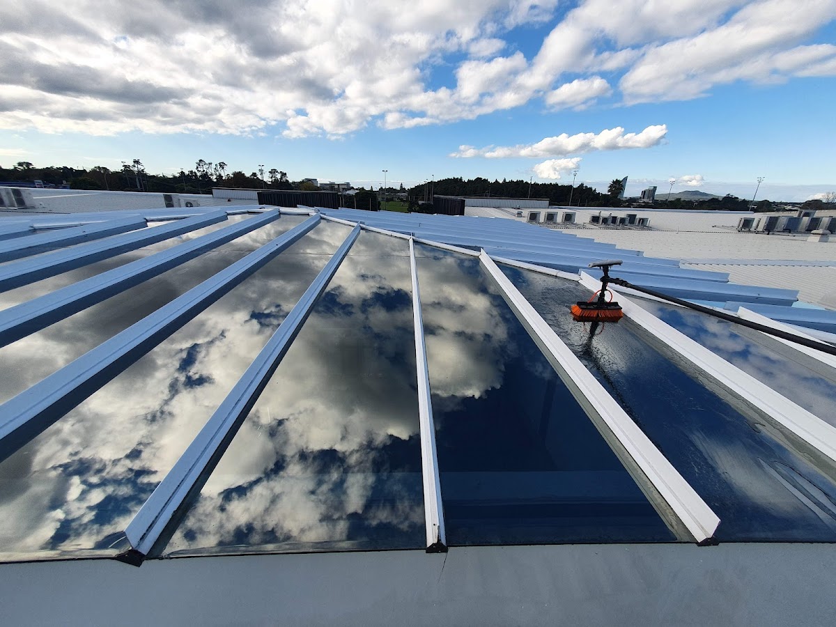 Commercial skylights reflecting clouds after professional cleaning